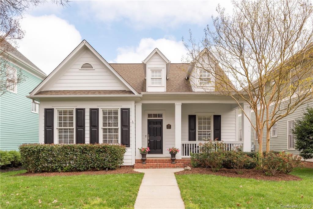 527 Fourth Baxter Crossing Fort Mill, SC 29708 - Photo 1 of 27 a view of a brick house with a yard plants and a large tree