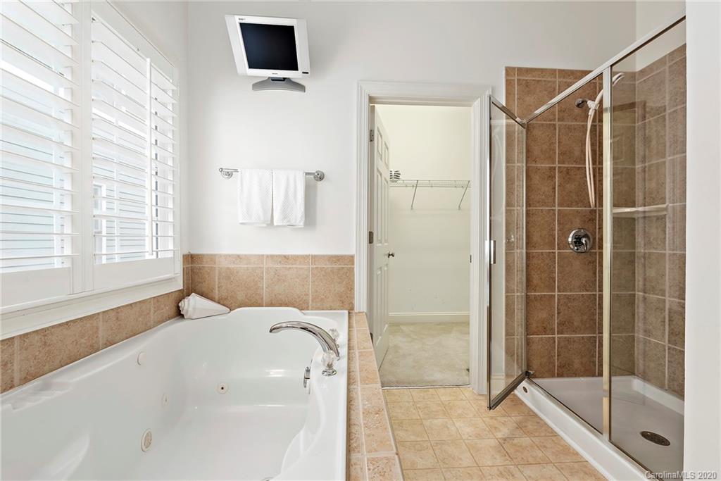 527 Fourth Baxter Crossing Fort Mill, SC 29708 - Photo 17 of 27 a bathroom with a bathtub and a shower