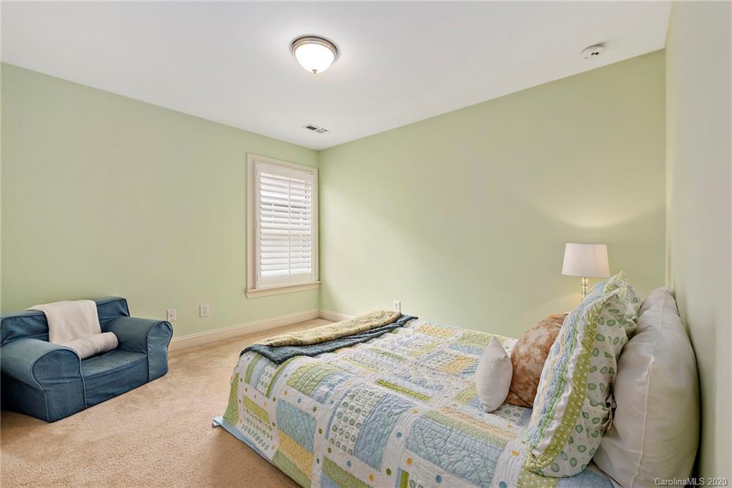 527 Fourth Baxter Crossing Fort Mill, SC 29708 - Photo 21 of 27 a bedroom with a bed and a couch
