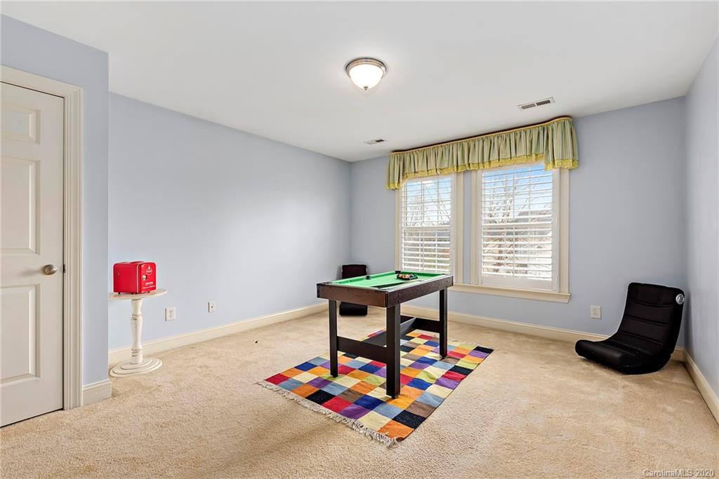 527 Fourth Baxter Crossing Fort Mill, SC 29708 - Photo 22 of 27 a living room with furniture and a window