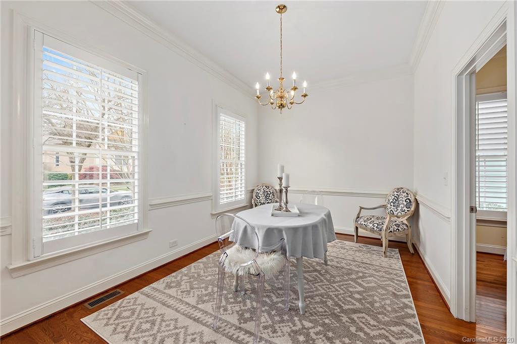 527 Fourth Baxter Crossing Fort Mill, SC 29708 - Photo 8 of 27 a view of a dining room with furniture window and wooden floor