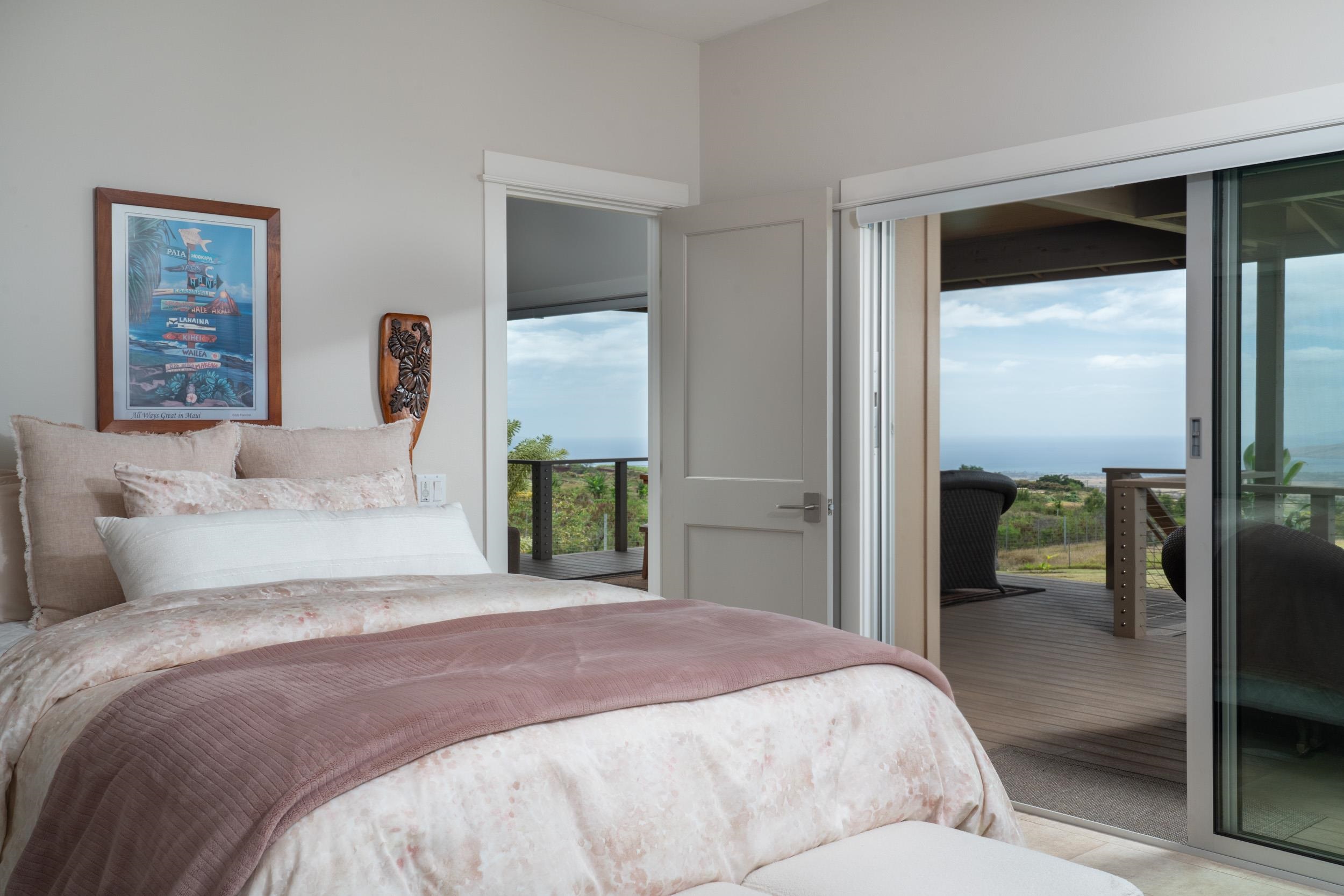 126 Hoomaikai Place Kula, HI 96790 - Photo 18 of 50 a bedroom with a large bed and a window