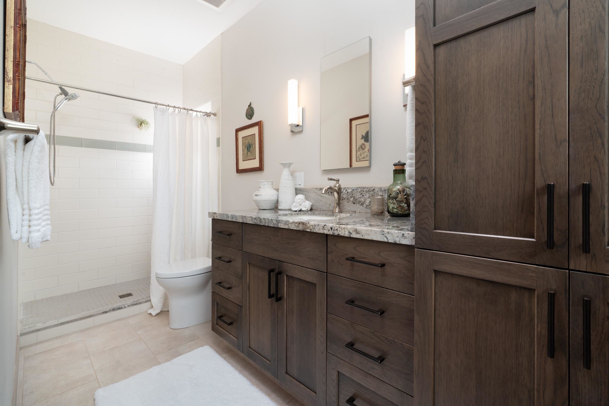 126 Hoomaikai Place Kula, HI 96790 - Photo 26 of 50 a bathroom with a granite countertop sink toilet and shower