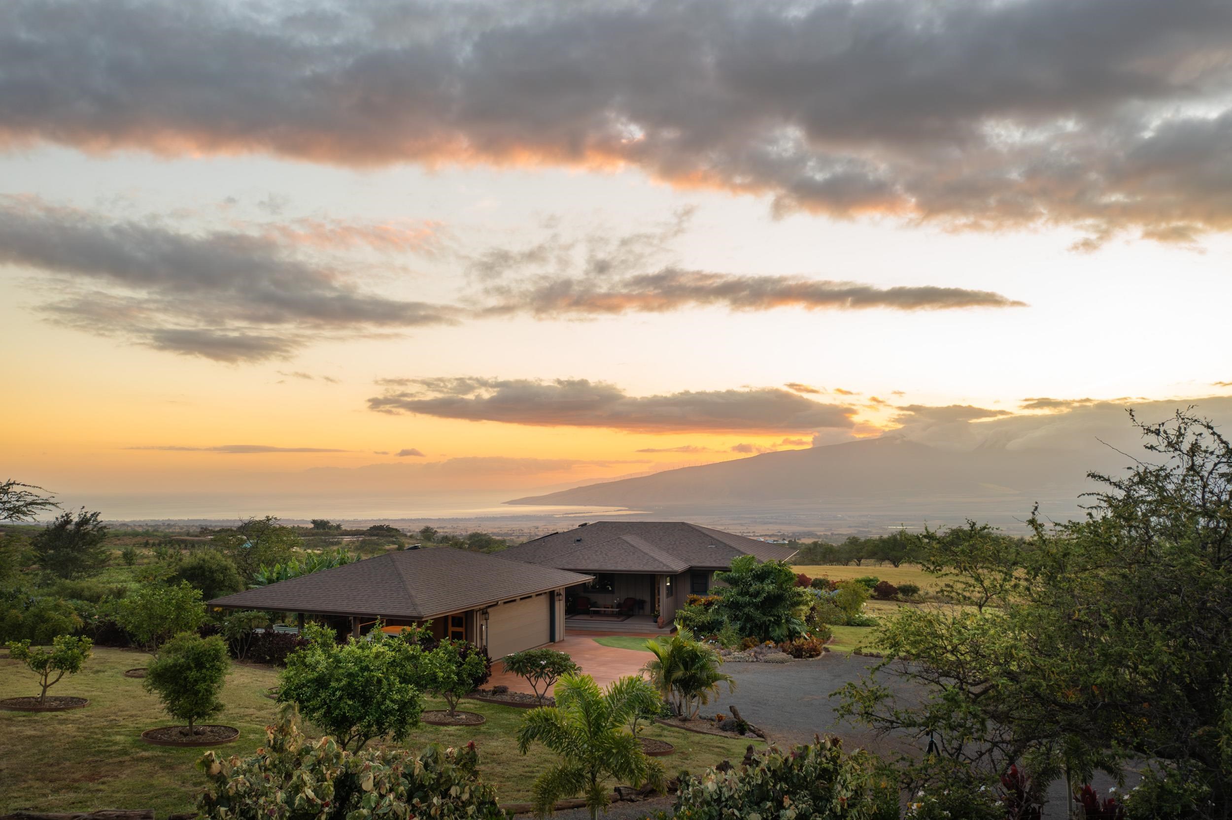 126 Hoomaikai Place Kula, HI 96790 - Photo 43 of 50 a view of a lake with mountains in the background