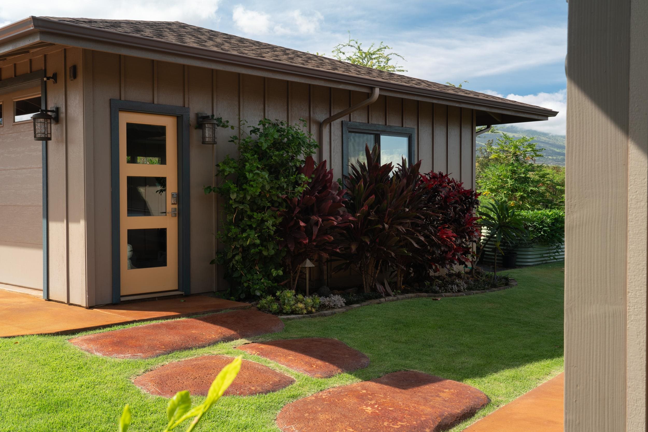 126 Hoomaikai Place Kula, HI 96790 - Photo 10 of 50 a view of a house with backyard and porch