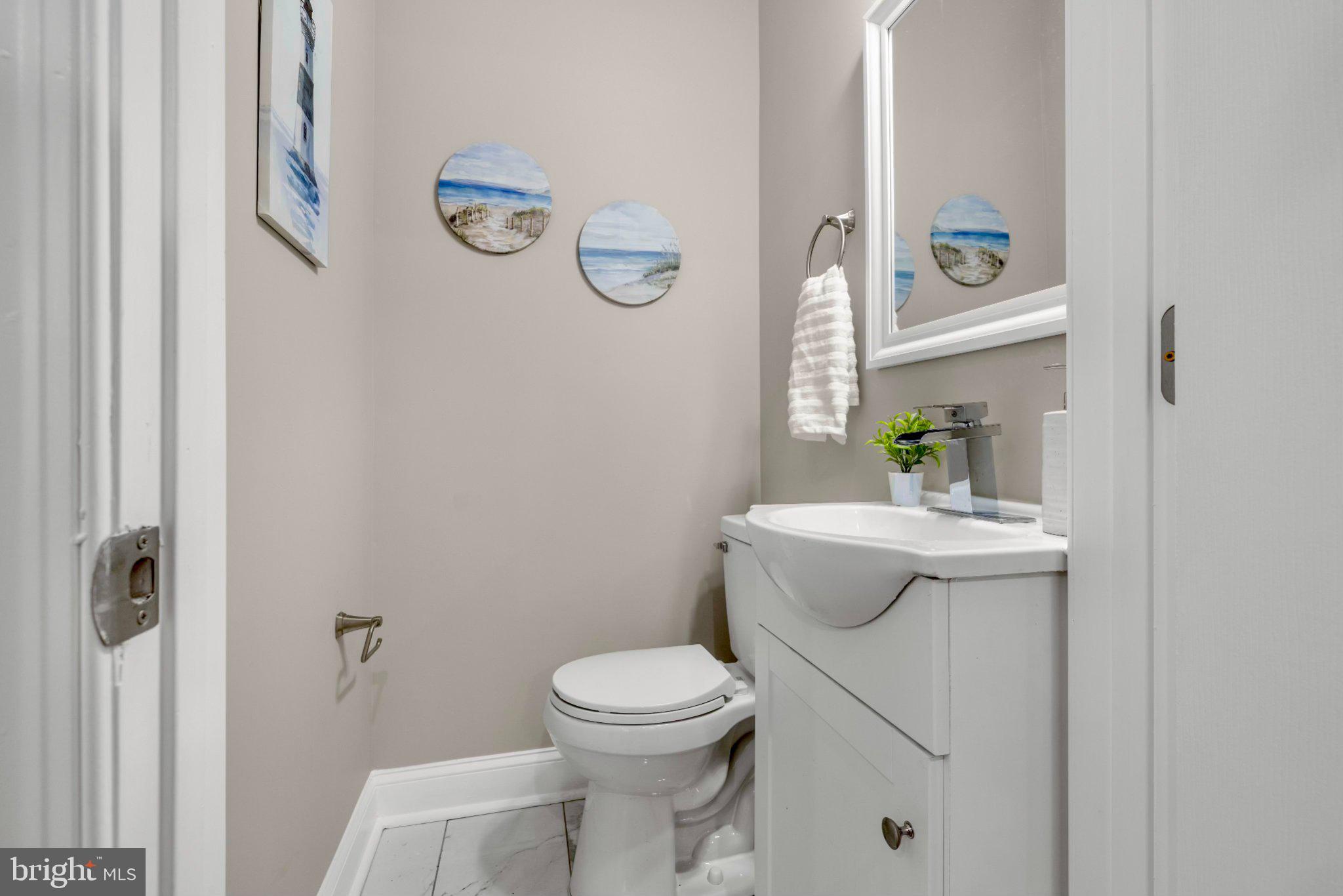 145 North Monastery Avenue Baltimore, MD 21229 - Photo 5 of 45 Coastal charm in a cozy bathroom.