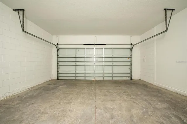 a view of a garage with an empty space