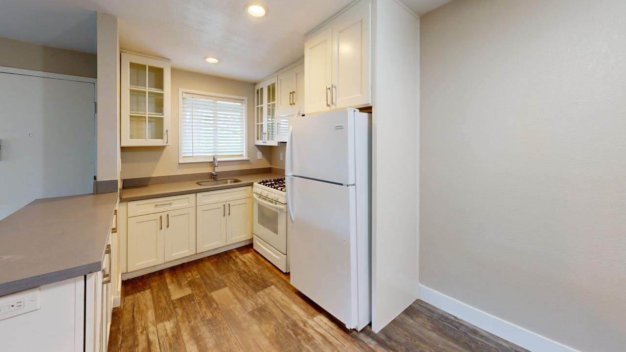 7 Merrydale Road San Rafael, CA 94903 - Photo 11 of 14 a kitchen with white cabinets and white appliances