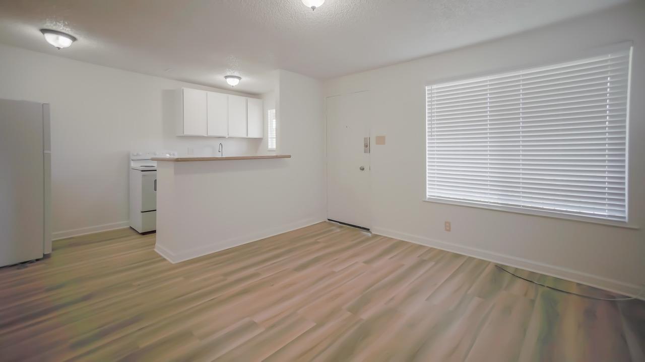 7 Merrydale Road San Rafael, CA 94903 - Photo 14 of 14 an empty room with wooden floor and windows