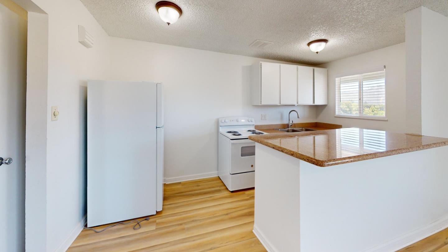 7 Merrydale Road San Rafael, CA 94903 - Photo 4 of 14 a kitchen that has a sink and a microwave in it