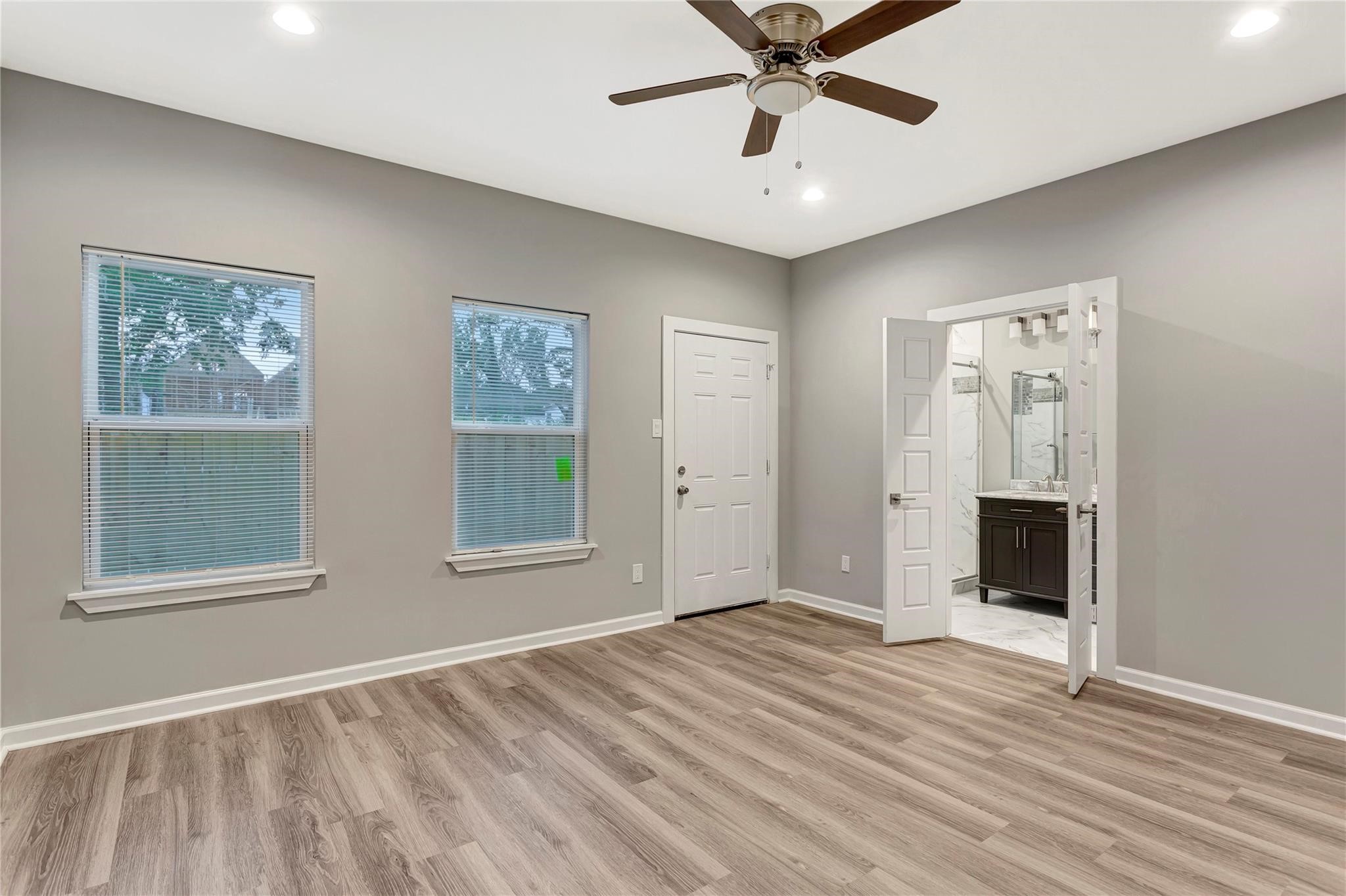 6813 Liverpool Street, Unit B Houston, TX 77021 - Photo 4 of 9 Spacious suite with dual windows, ceiling fan, and direct access to the en-suite bath and walk-in closet.