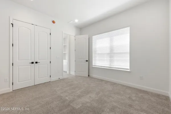 a bathroom with a toilet and a bathtub