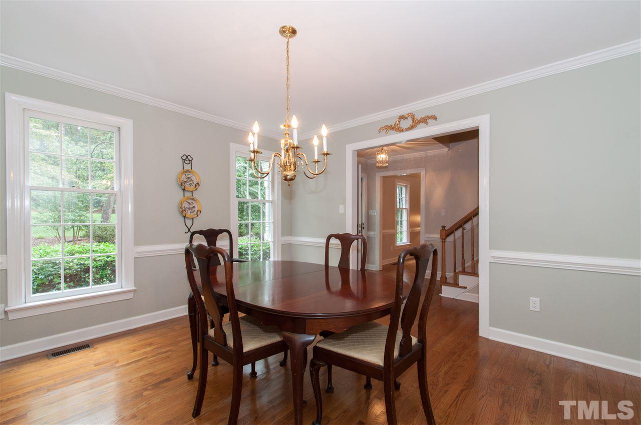 1316 October Road Raleigh, NC 27614 - Photo 2 of 25 a view of a dining room with furniture window and wooden floor