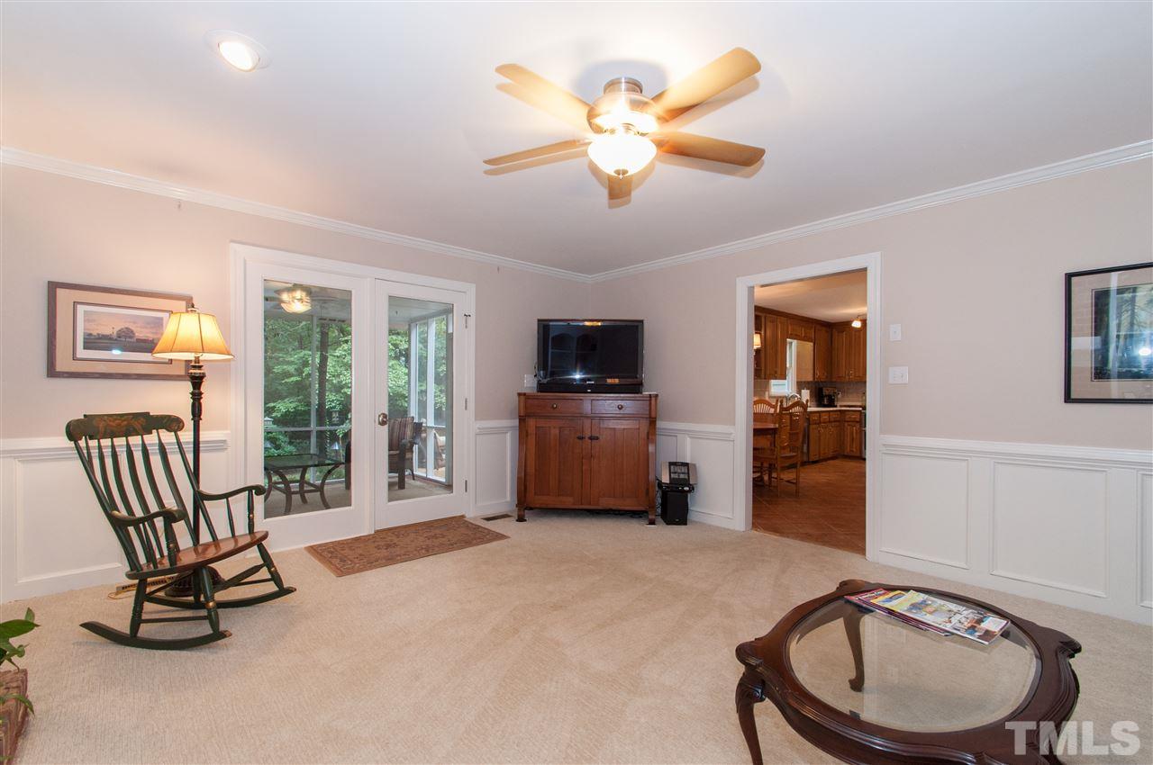 1316 October Road Raleigh, NC 27614 - Photo 11 of 25 a bedroom with furniture a chandelier and a flat screen tv