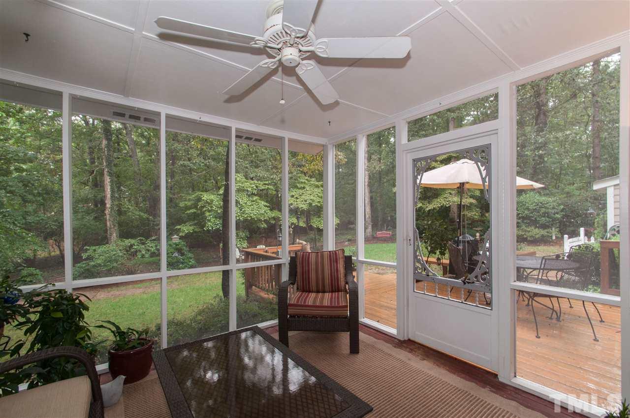 1316 October Road Raleigh, NC 27614 - Photo 12 of 25 a living room with a large window and a porch