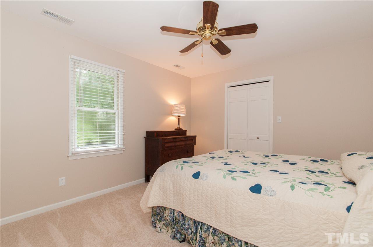 1316 October Road Raleigh, NC 27614 - Photo 18 of 25 a bedroom with a bed and a window