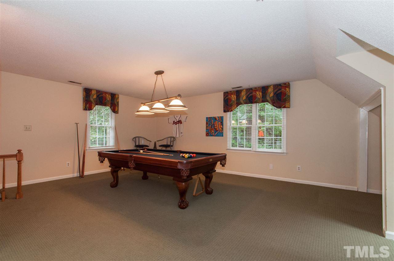 1316 October Road Raleigh, NC 27614 - Photo 22 of 25 a living room with furniture and a window
