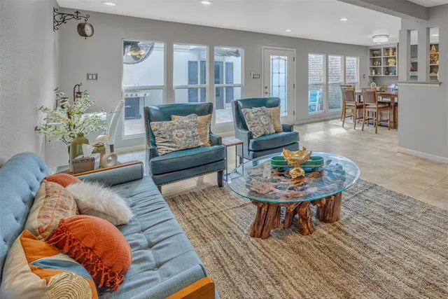 a living room with furniture and a rug