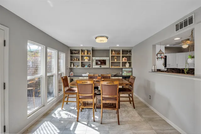 a view of a dining room with furniture window and outside view