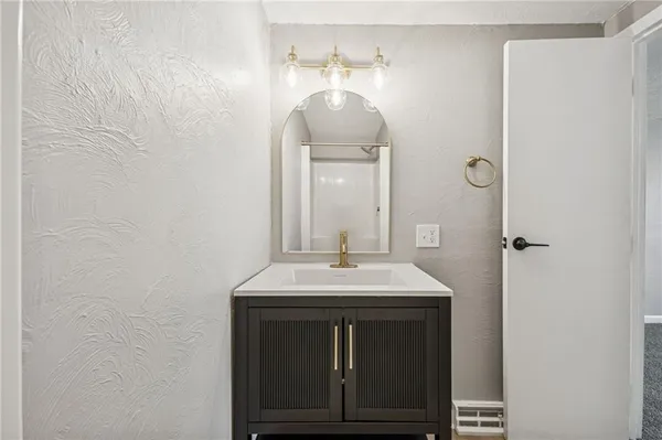 a sink with a mirror