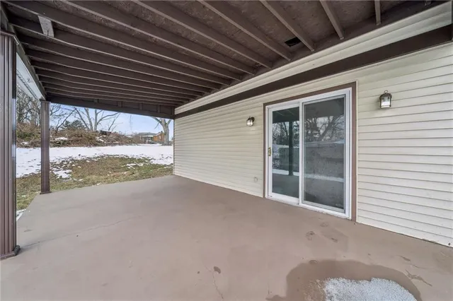 a view of an empty room with a balcony