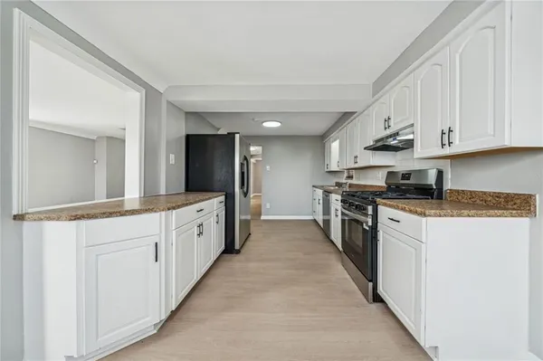 a large kitchen with cabinets