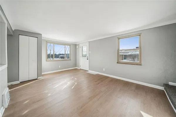 a view of an empty room with a window