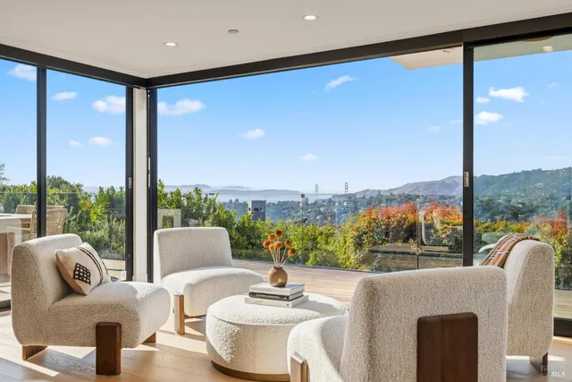 a view of a city from a dining room with large windows