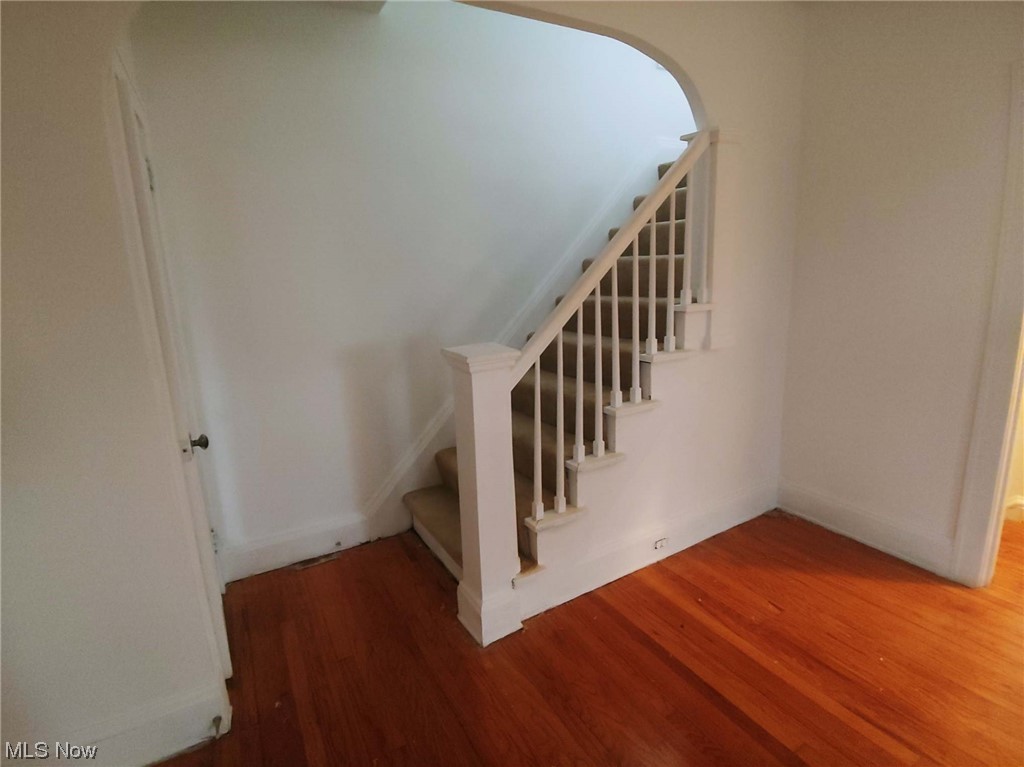 1464 Sherbrook Road Cleveland, OH 44121 - Photo 4 of 15 Stairs featuring wood-type flooring