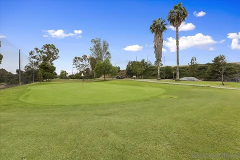 a view of a golf course with a lake
