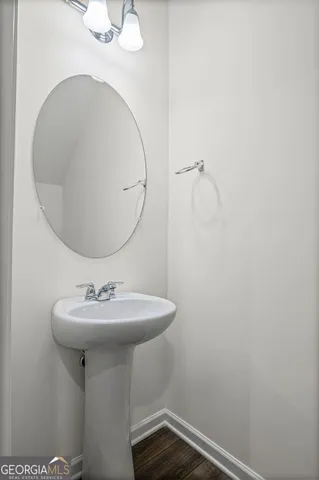 a bathroom with a sink a mirror and vanity