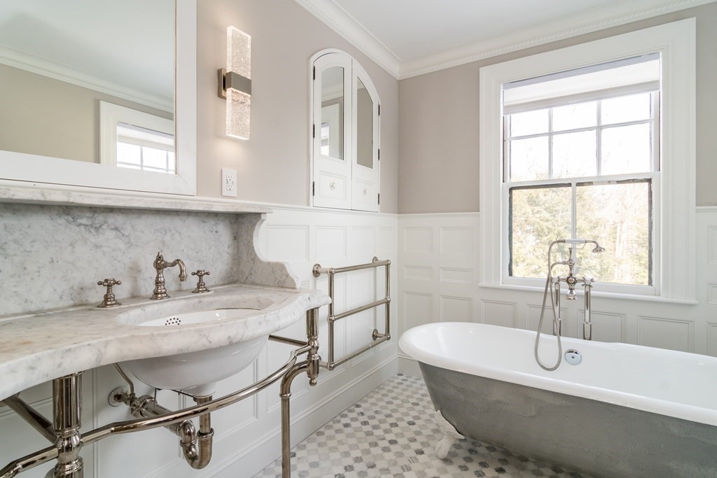 30 Cliff Road Wellesley, MA 02481 - Photo 14 of 30 a bathroom with a tub a sink and a window