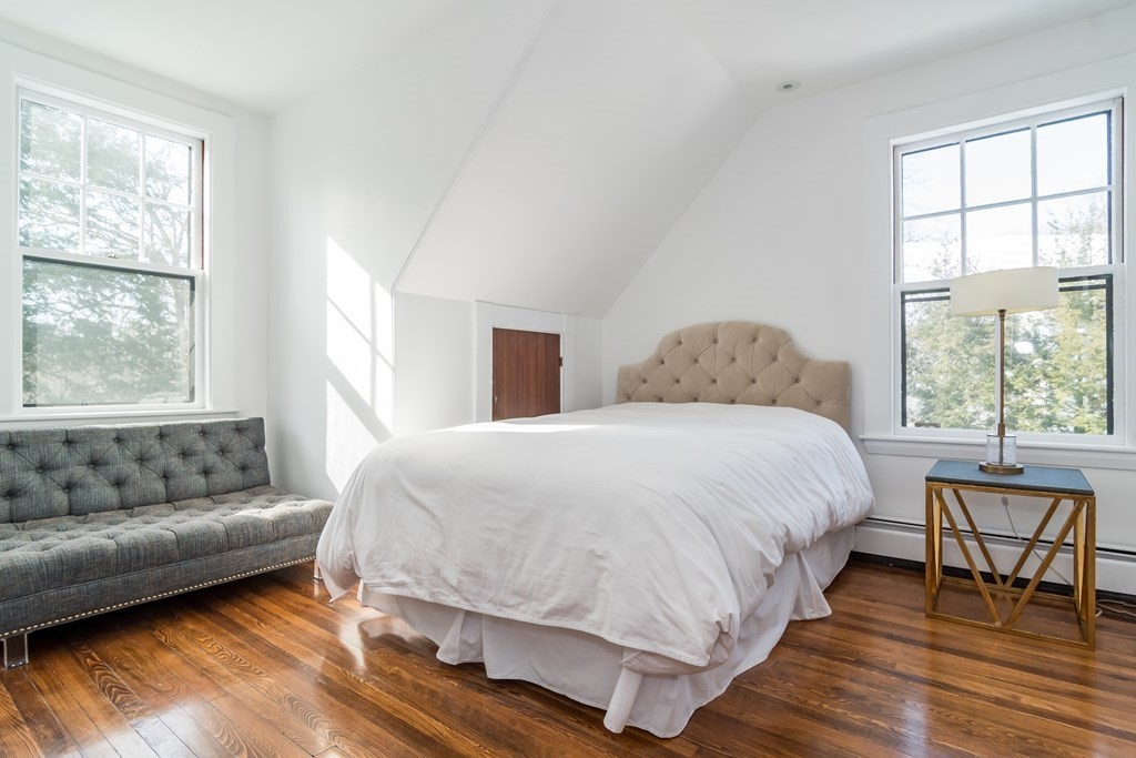 30 Cliff Road Wellesley, MA 02481 - Photo 20 of 30 a spacious bedroom with a bed and windows