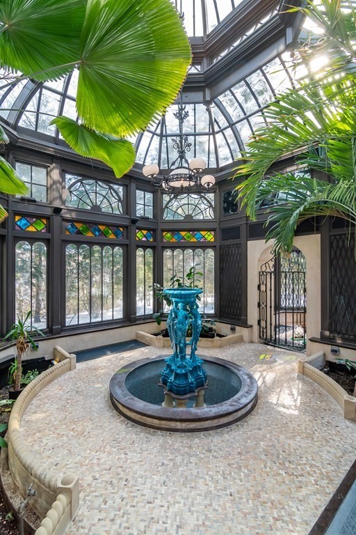 30 Cliff Road Wellesley, MA 02481 - Photo 21 of 30 a view of a house with a fountain in a patio