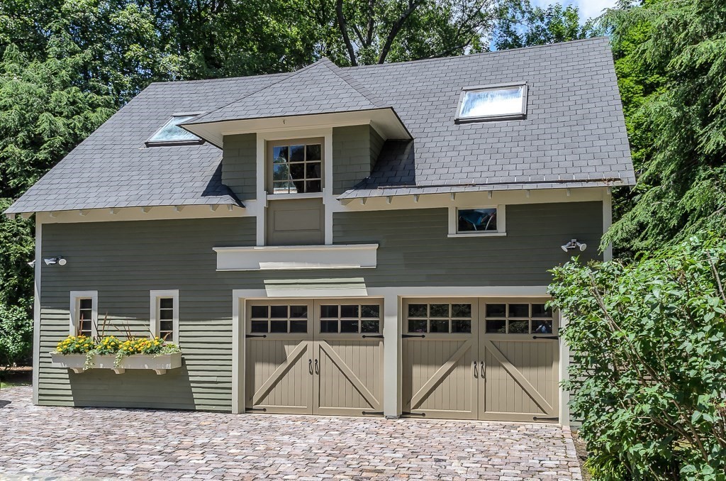 30 Cliff Road Wellesley, MA 02481 - Photo 24 of 30 a backyard of a house with large trees and barbeque oven