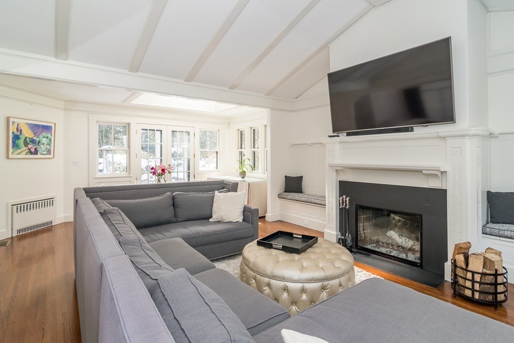 30 Cliff Road Wellesley, MA 02481 - Photo 5 of 30 a living room with furniture a flat screen tv and a fireplace