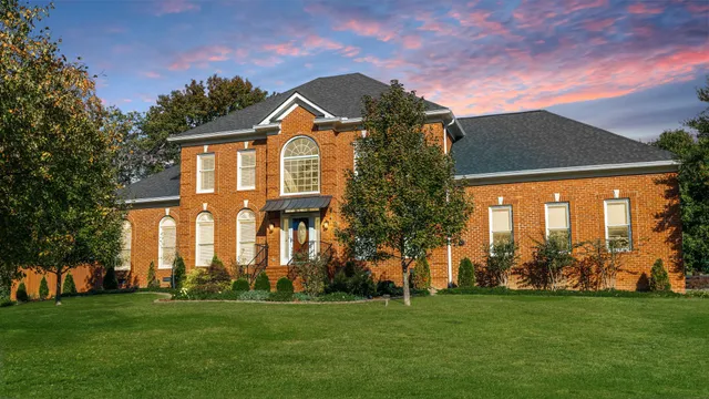 a view of entryway livingroom and hall with wooden floor
