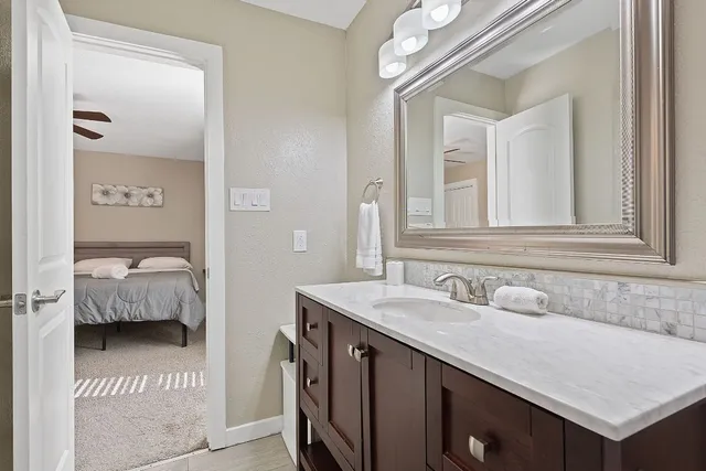 a bathroom with a toilet a sink and bathtub