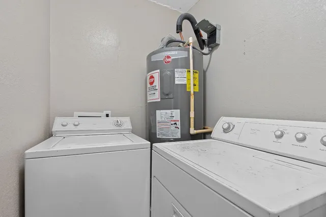 a view of a chair and table in the backyard