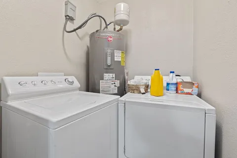 a backyard of a house with table and chairs