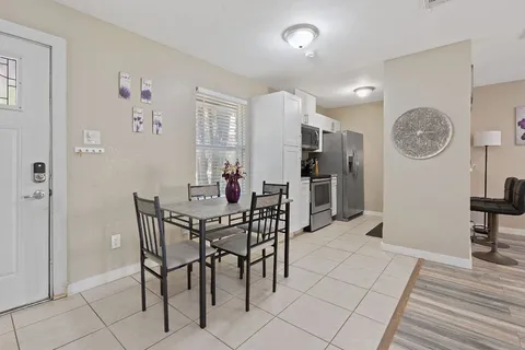 a spacious bedroom with a bed and a couch