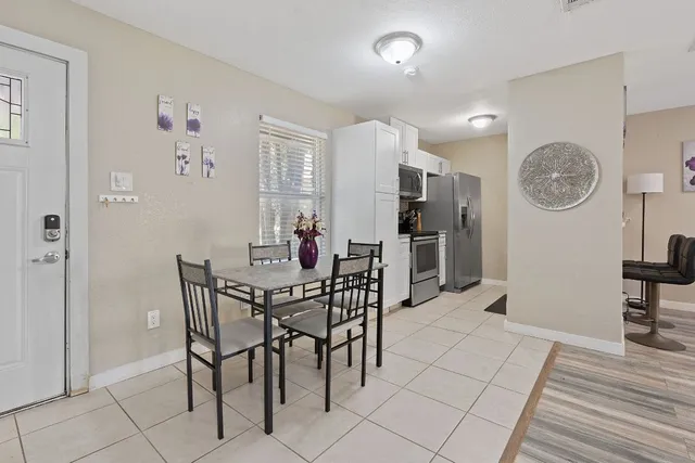 a spacious bedroom with a bed and a couch