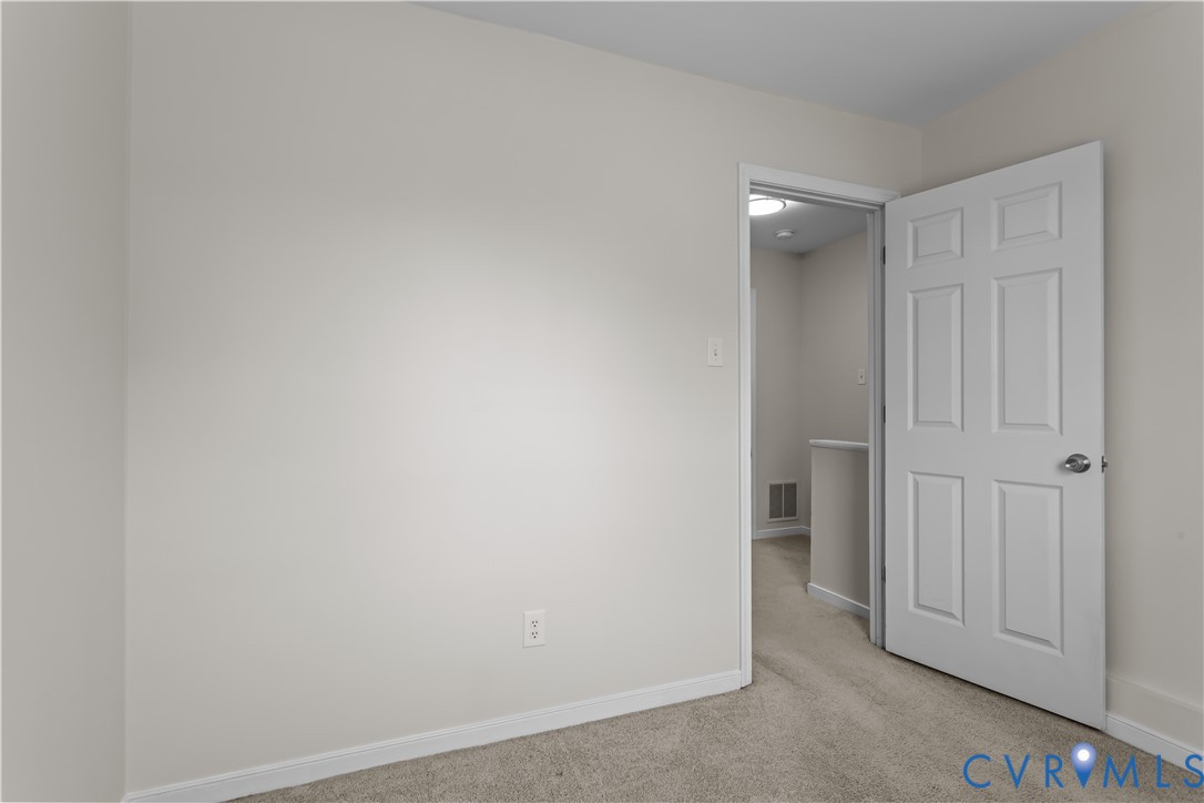 4801 Penick Road Richmond, VA 23228 - Photo 25 of 39 Bedroom featuring light carpet and baseboards