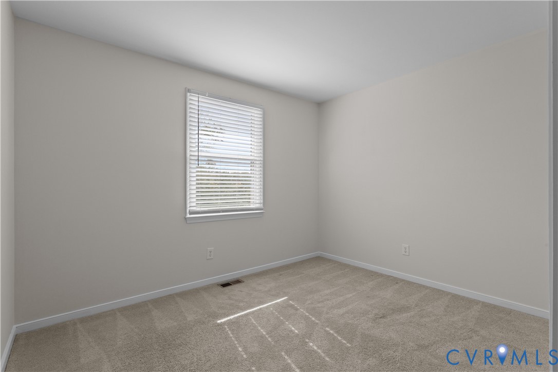 4801 Penick Road Richmond, VA 23228 - Photo 26 of 39 Bedroom with light colored carpet and baseboards