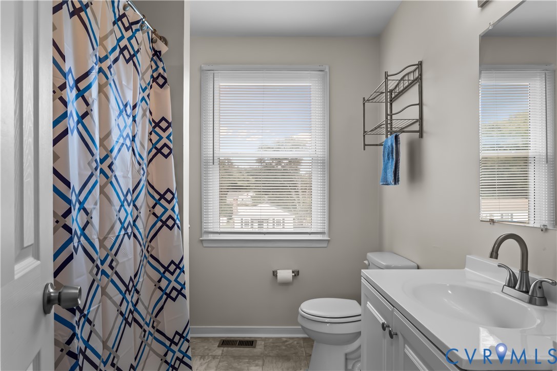 4801 Penick Road Richmond, VA 23228 - Photo 28 of 39 Bathroom featuring vanity, plenty of natural light