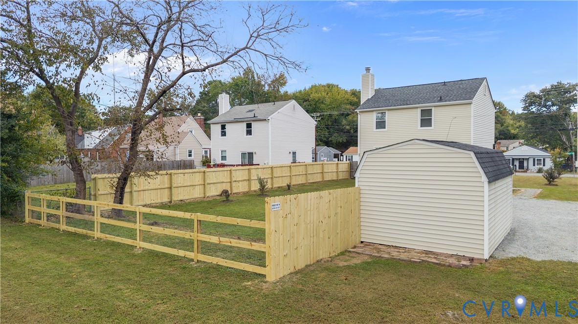 4801 Penick Road Richmond, VA 23228 - Photo 33 of 39 View of yard with a residential view and a storage
