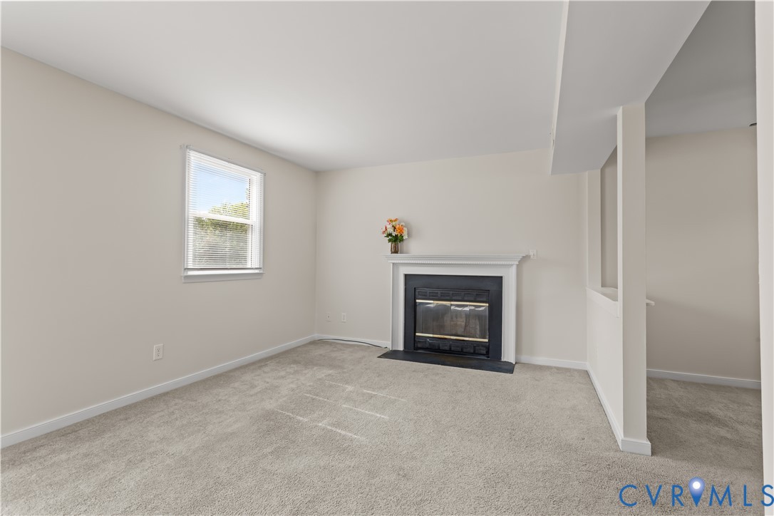 4801 Penick Road Richmond, VA 23228 - Photo 7 of 39 Living room featuring a fireplace with flush heart