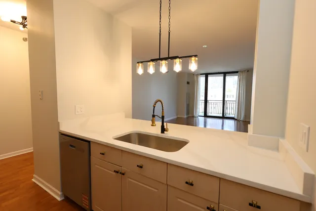 a kitchen with a sink and a window