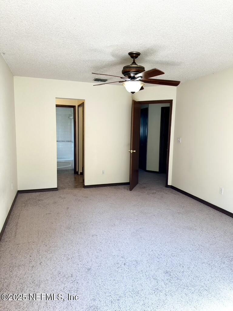 11368 Canvasback Court Jacksonville, FL 32225 - Photo 11 of 19 a view of a room with a ceiling fan
