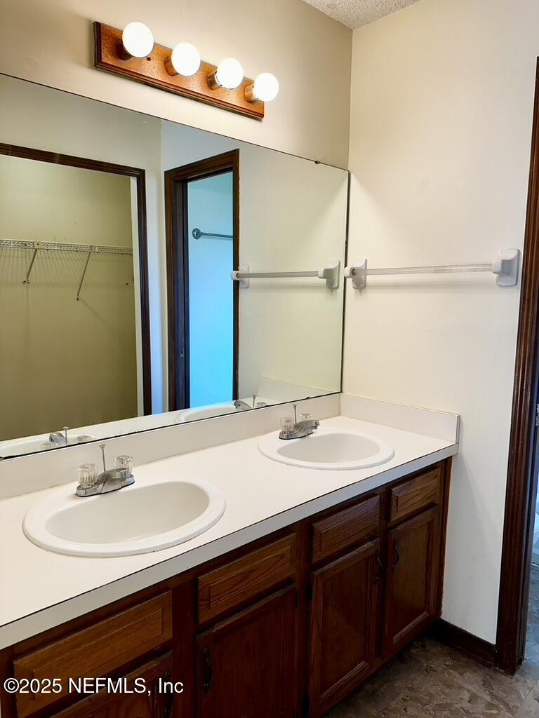 11368 Canvasback Court Jacksonville, FL 32225 - Photo 13 of 19 a bathroom with a sink and a mirror